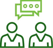 Two people talking to each other with a green speech bubble above them